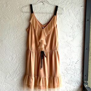 Tan dress with black stripes and black tie.